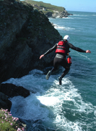 Man from a stag party in Mid Jump whilst Coasteering